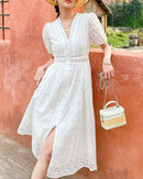 Women's White pure cotton high-waisted button-down dress featuring intricate eyelet embroidery, a V-neck, and puff sleeves, perfect for summer and formal occasions.
