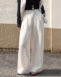  High waisted draped straight leg trousers for women, crafted from soft and breathable premium fabric, perfect for office wear and spring minimalism, showcasing a relaxed silhouette.
