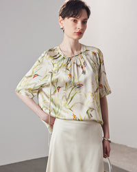 Stylish loose-fit silk t-shirt for women, designed with an intricate  print pattern and crafted from high-quality breathable mulberry silk for the spring and summer season.