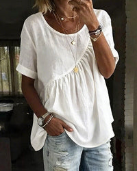 Front view of a solid color women's round neck t-shirt featuring a flattering pleated design, short sleeves, and a relaxed fit for Spring and Summer.