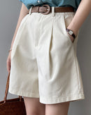 Women's high-waisted loose-fit suit shorts made from, featuring a structured waist and a relaxed silhouette perfect for professional or smart-casual summer fashion.
