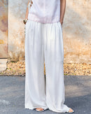 Elevate your warm-weather wardrobe with our relaxed linen drawstring wide leg pants.