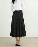 Elegant high waisted loose a-line cake skirt, crafted from soft and breathable premium fabric, perfect for spring and summer minimalism, showcasing a relaxed silhouette.