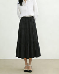 Elegant high waisted loose a-line cake skirt, crafted from soft and breathable premium fabric, perfect for spring and summer minimalism, showcasing a relaxed silhouette.