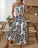 Discover our lightweight, flowy botanical maxi dress. Featuring a bold leaf print, button-front design, and adjustable waist belt—perfect for beach days, brunch, and warm-weather getaways.