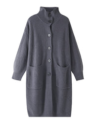 Wrap yourself in soft luxury with Gentle Herd’s longline knit cardigan. This stand collar wool features ribbed texture and functional pockets, perfect for cozy layering all season long.