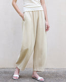 Tencel and ramie trousers, featuring an elastic high waisted design and relaxed nine-point silhouette, crafted from breathable natural fibers for a minimalist spring aesthetic and quiet luxury comfort.