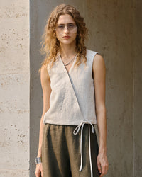 Flowy loose-fit linen vest featuring a diagonal chest detail and wide armholes for a comfortable summer look.