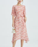 Women's loose-fit round neck dress featuring a vibrant floral print on soft [Material] and a comfortable silhouette perfect for spring and summer outings.