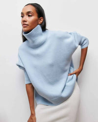 Oversized 100 % cashmere turtleneck sweater, slouchy drop shoulders, ribbed high neck, heather taupe—cloud-soft winter staple for him or her.