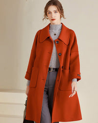 Women’s double-faced wool coat with playful Peter Pan collar, knee-length A-line silhouette,  concealed snap front, premium wool, lightweight warmth for winter commutes or weekend strolls.