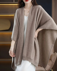 Women’s merino-wool cardigan with attached scarf-shawl collar and relaxed long sleeves—cloud-soft layer for autumn cafés, office layering or weekend cabin escapes.