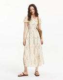 Women's apricot printed halter-neck dress – ruffled details, waist-accentuated fit, polyester fabric, pullover design, perfect for summer casual outings or light occasions.