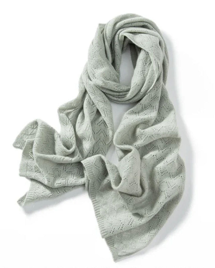Woman looping a Pure Cashmere Hollow-Out Long Scarf, 19-micron Inner-Mongolia cashmere and open-work lattice knit give cloud-soft warmth—your wind-proof 35-55 °F fall-through-spring wrap that doubles as a blanket on flights.