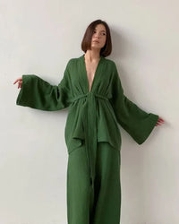 Woman lounging in a Pure-Cotton Robe and Trousers Lounge Set, airy 100 % cotton jersey and relaxed V-neck robe give spa-level comfort—your breathable 70-85 °F summer-night essential.