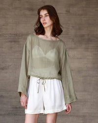 Women’s pure ramie long-sleeved tee with drawstring hem and relaxed round neck—airy sun-smart layer for beach walks, tropical flights or summer city strolls.