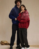 Woman street-styling a retro-gradient washed hoodie, sun-fade lilac-to-mint dip-dye and distressed holes give lived-in 90s attitude—perfect lightweight fleece for 60-75 °F spring-fall layering.