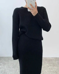 Woman brunching in a Ribbed Knitted Round-Neck Sweater & Midi Skirt Set, airy 55 % viscose / 45 % polyester rib drapes like jersey—your cozy yet polished 60-75 °F spring-fall statement.