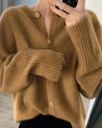 Cashmere short cardigan, round neckline, button-front, ribbed cuffs, heather taupe—luxury lightweight layer for spring-to-fall outfits.