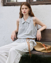 Woman styling a sand-beige ruching-detail textured blouse, subtle crinkles and front gathers add tactile depth—pair with tailored pants for effortless desk-to-dinner elegance.