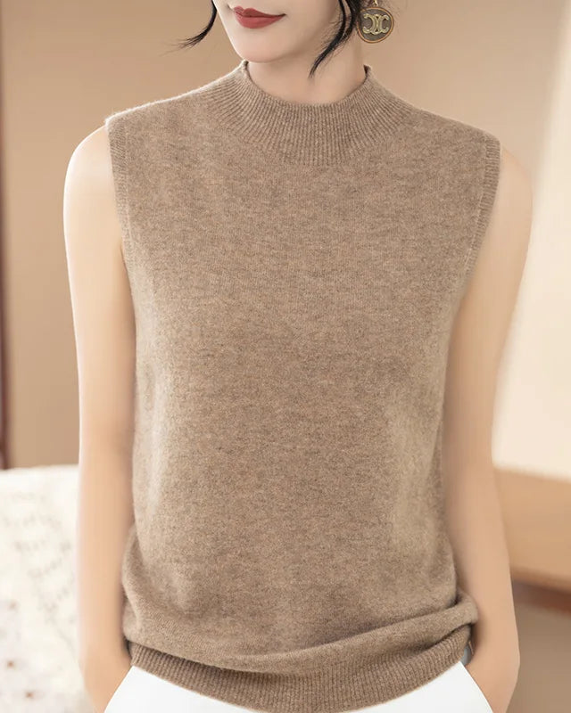 100% merino wool sleeveless mock neck sweater vest. Soft, breathable solid-color knit for women — perfect for all-season layering.