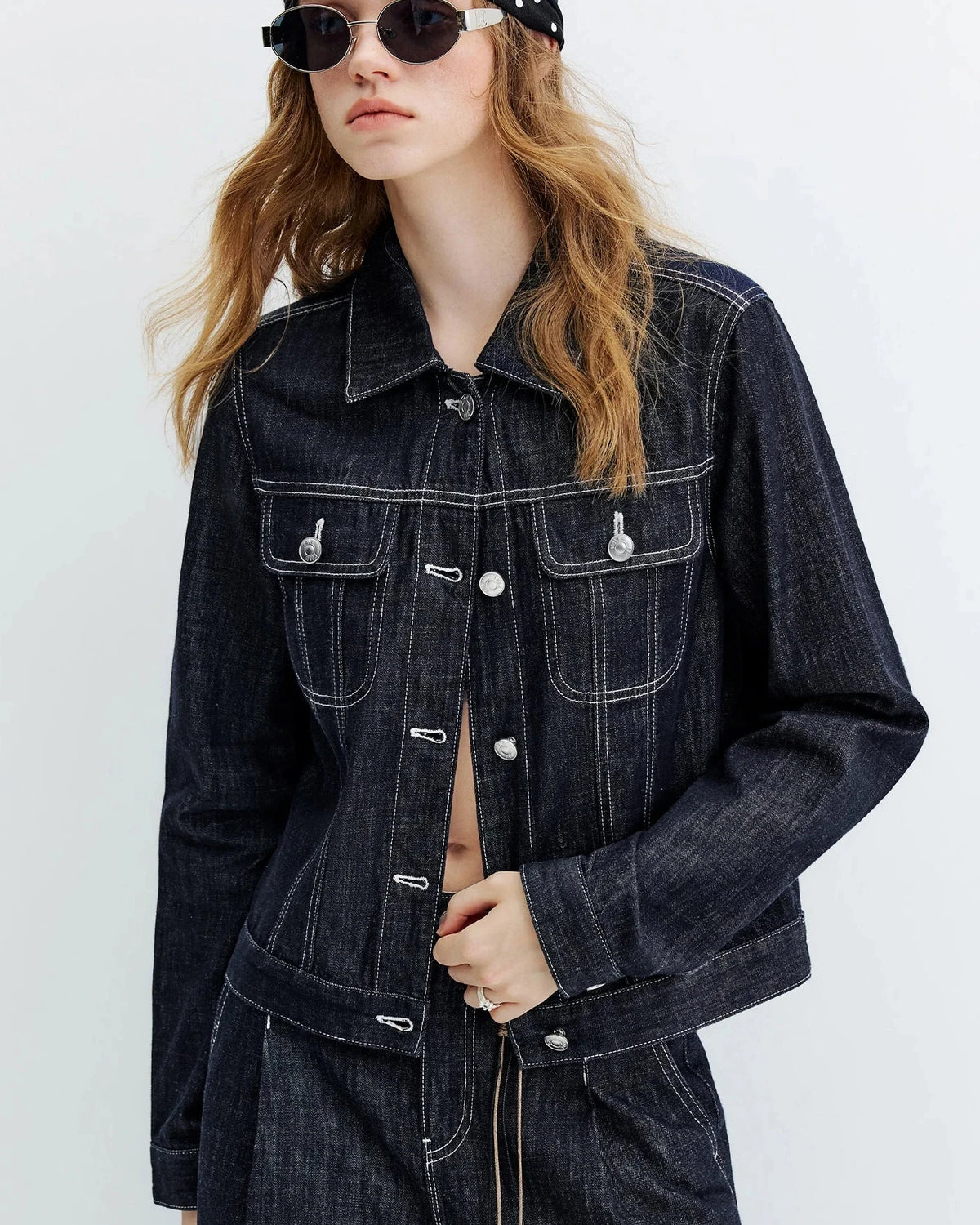 A slim 100% cotton denim jacket with a polo collar, button front and practical pockets, designed for Y2K streetwear style that layers from day to night.