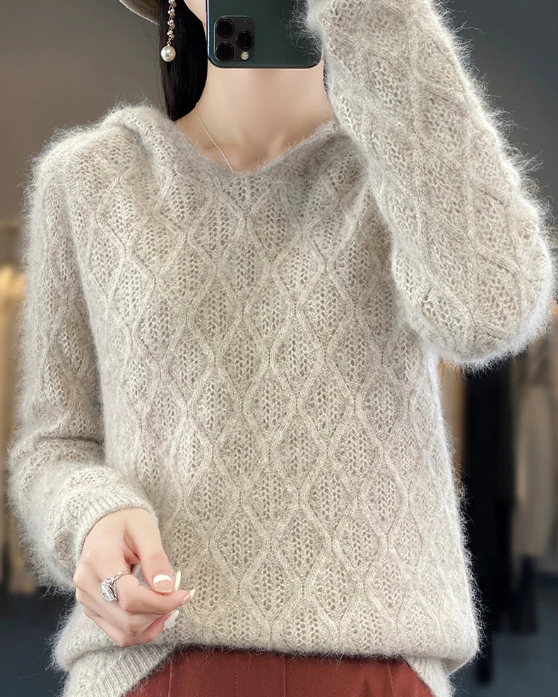 Women's Mink Cashmere hooded sweater featuring a relaxed hood and pullover silhouette, crafted from pure luxury wool for lightweight warmth and cozy elegance in air-conditioned indoor settings.