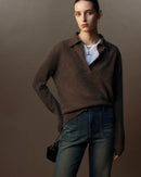 The loose fit allows easy movement, while the structured polo collar adds quiet character.