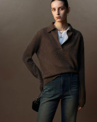 The loose fit allows easy movement, while the structured polo collar adds quiet character.