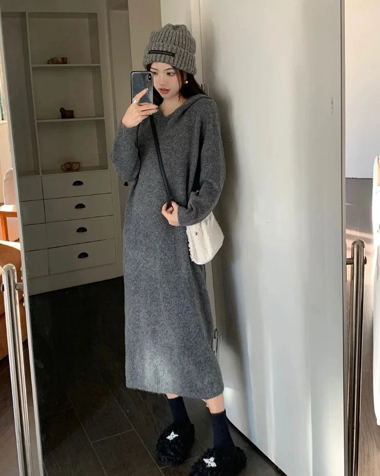 Extrafine merino wool knit maxi dress. Oversized V-neck pullover silhouette, naturally temperature-regulating, perfect for autumn and winter. 