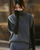 The turtleneck silhouette has endured as one of knitwear's most refined expressions. This sleeveless interpretation takes that heritage and distills it into a clean, wearable form suited to the modern woman's wardrobe.
