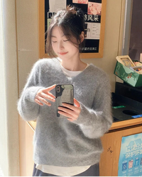 A pure cashmere fluffy pullover featuring a V-neck, a loose fit, and a heavyweight long-hair knit for soft, elegant warmth.