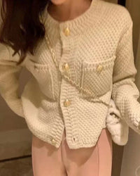 A round neckline frames the face, while the full button front lets you adjust how you wear it.