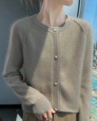 A refined cashmere cardigan designed for effortless seasonal dressing, this piece combines a relaxed shape with a smooth, flexible feel.