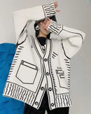 A graphic wool blend V-neck cardigan with loose fit, single-breasted front and graphic print panels, designed for a relaxed winter layering look that pairs from sneakers to boots.