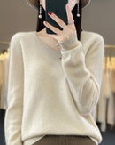 Women's Extrafine Merino wool V-neck sweater featuring a slim silhouette and 17.9-micron superfine fibre, crafted from pure Australian wool for breathable warmth and elegant layering in air-conditioned indoor settings.