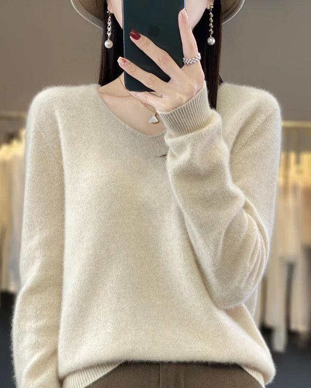 Women's Extrafine Merino wool V-neck sweater featuring a slim silhouette and 17.9-micron superfine fibre, crafted from pure Australian wool for breathable warmth and elegant layering in air-conditioned indoor settings.