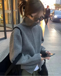 A 100% cashmere turtleneck cardigan with a two-way zip and extra-heavy knit, designed for loose, thick winter warmth in a versatile style.