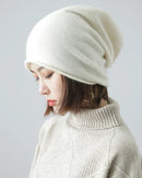 65% wool & 35% cashmere slouchy beanie with natural rolled edge. Oversized, hair-friendly & pressure-free — effortless unisex winter style.