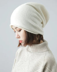 65% wool & 35% cashmere slouchy beanie with natural rolled edge. Oversized, hair-friendly & pressure-free — effortless unisex winter style.