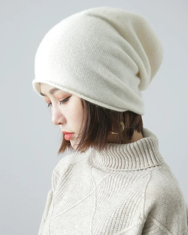 65% wool & 35% cashmere slouchy beanie with natural rolled edge. Oversized, hair-friendly & pressure-free — effortless unisex winter style.