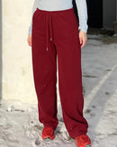 Women's high-waisted wide-leg sweatpants made from breathable cotton blend, featuring a climate-regulating fabric and elastic waist for spring and autumn comfort.