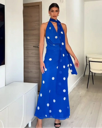 Sleeveless maxi dress with polka dot print, swinging collar, backless zipper and slim sheath fit. Lightweight polyester — chic beach and holiday style.