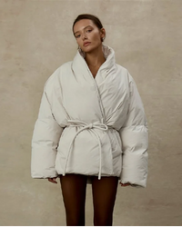 The wrap collar adds gentle volume around the neckline, complemented by long sleeves and a waist you can define.