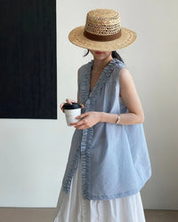 Reversible V-neck sleeveless knit top with lettuce edge trim and mid-length fit. Lightweight polyester knit — Korean casual style for summer layering.