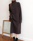 A mid-calf cashmere sweater dress with a half high collar and raglan sleeves, designed for a loose H-line fit that drapes easily over boots.