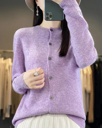 This merino wool cardigan wraps you in a cloud-like softness that only natural fiber can deliver. Knitted in a fine 12-gauge construction, it holds its shape beautifully through repeated wear while remaining feather-light on the body.