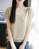 Women's crew-neck sleeveless knit top featuring a linen-lyocell blend, breathable fabric, and an elongated silhouette for minimalist layering in the city.