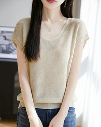 Women's crew-neck sleeveless knit top featuring a linen-lyocell blend, breathable fabric, and an elongated silhouette for minimalist layering in the city.