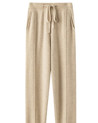 A wool-blend wide-leg knit pant with high waist, elastic waistband and loose full-length fit, designed for a relaxed autumn-winter look that pairs from sneakers to boots.